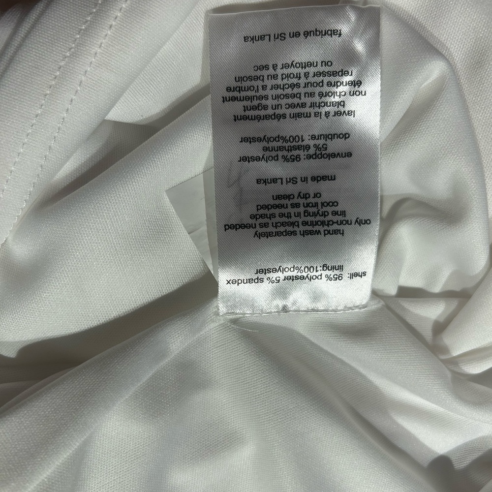 Long sleeve white jersey dress with side draping. NWT Size 12. - Picture 5 of 6